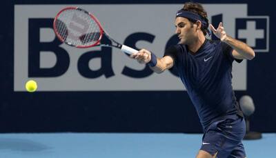 Roger Federer battles into Swiss Indoors quarters