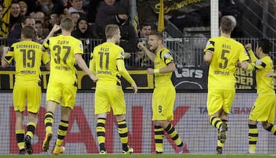 Dortmund, Wolfsburg win, Schalke held in Bundesliga