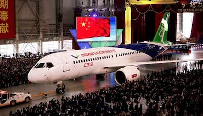 China rolls out its first passenger plane C919; to take on Airbus, Boeing