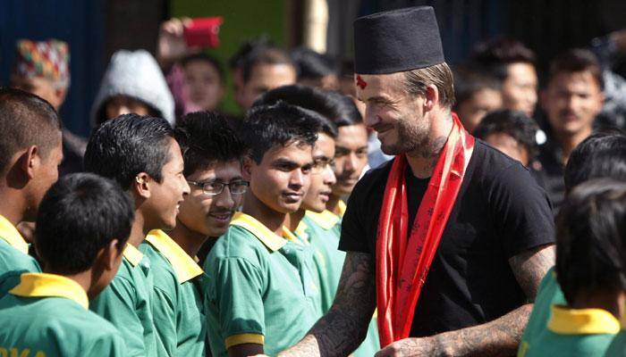 David Beckham plays soccer with Nepalese children