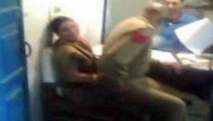 Cop sits on woman officer's lap; pic goes viral on social media