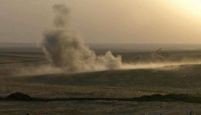 Sirens ring out as air strikes hit Islamic State's Syria stronghold