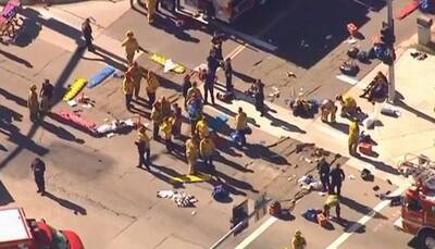 San Bernardino shooting: 14 killed in California; 2 suspects including a woman dead, third held