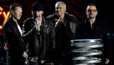 U2 plays rescheduled Paris show, pays tribute to victims