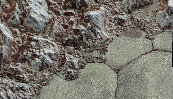 Now in colour: Close-up pics of Pluto sent by New Horizons spacecraft