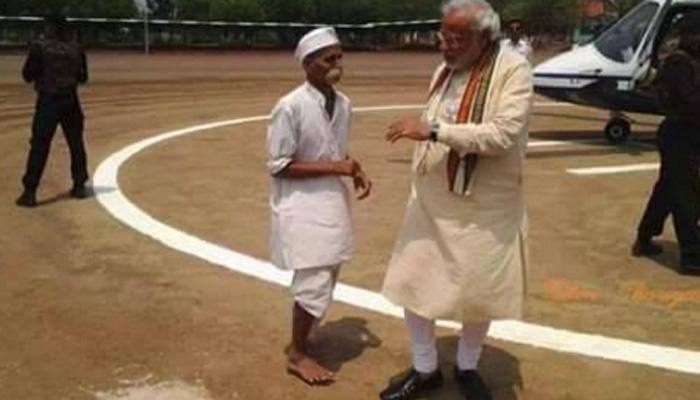 Who is this man with Narendra Modi?
