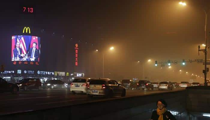 Ten Chinese cities issue pollution red alert