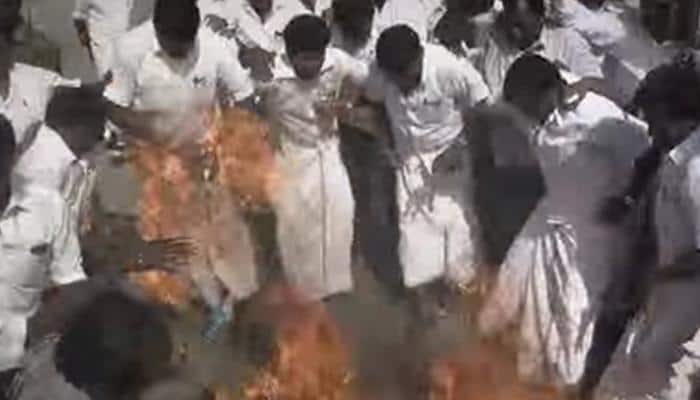 Watch: AIADMK worker&#039;s lungi catches fire while burning DMDK chief&#039;s effigy
