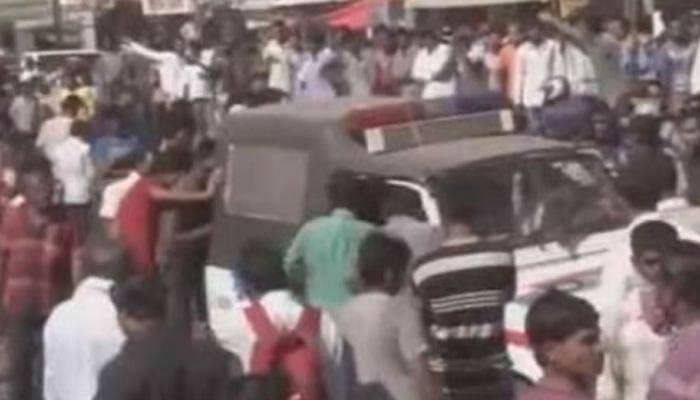 Mob thrashes Gujarat policeman, sets bike on fire – Watch video