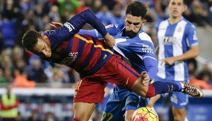 FC Barcelona held by Espanyol, Atletico Madrid go top