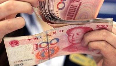 China cuts yuan to weaker than 6.5 against dollar