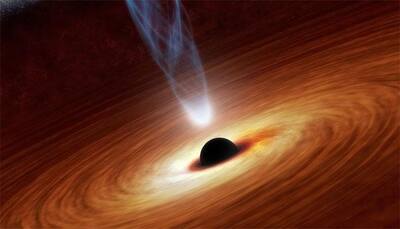 Rare galaxy with 2 black holes has 1 starved of stars