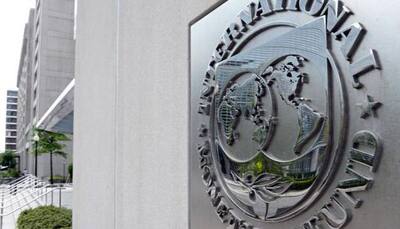 IMF cuts world growth forecast, warns of emerging market risks
