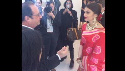 Aishwarya Rai Bachchan stuns in red saree at luncheon with Hollande