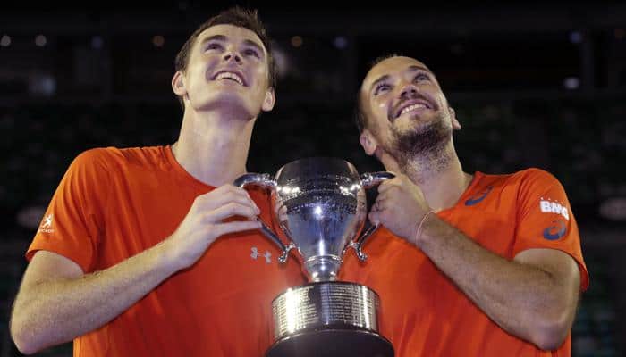 Australian Open:  Jamie Murray wins men&#039;s doubles title as brother Andy films trophy presentation