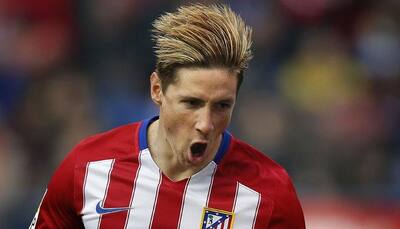 Atletico Madrid keep pressure on Barcelona as Fernando Torres reaches century