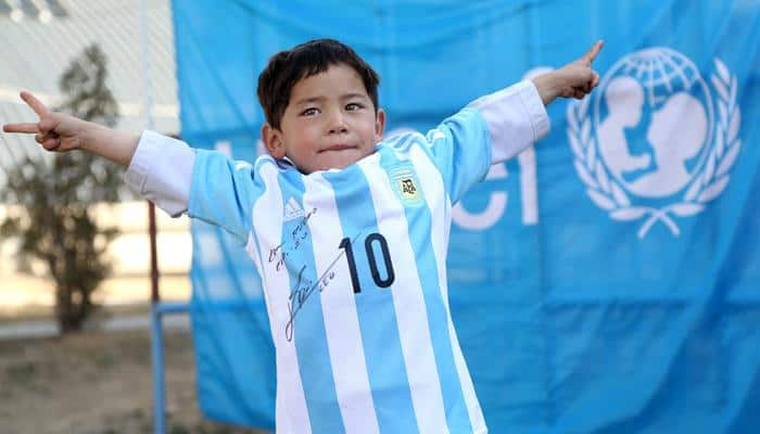 From plastic jersey to the real thing, Afghan boy gets signed Lionel Messi shirt