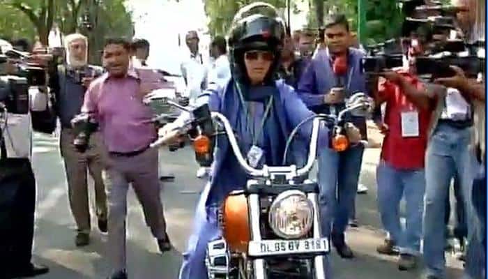 Pappu Yadav&#039;s wife Ranjeet Ranjan rides on Harley-Davidson motorcycle to Parliament on International Women&#039;s Day
