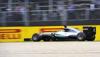 Australian GP: Mercedes' Lewis Hamilton on pole as new-look format flops
