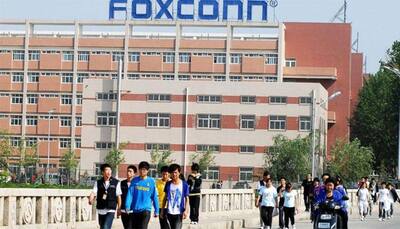 Foxconn agrees to buy Sharp after slashing original offer 