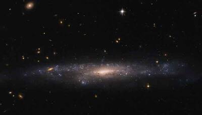 Hubble spots galaxy hidding in night sky – See pic!