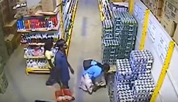 UNBELIEVABLE: Woman steals 24 beer cans by hiding them under her skirt - Watch CCTV video