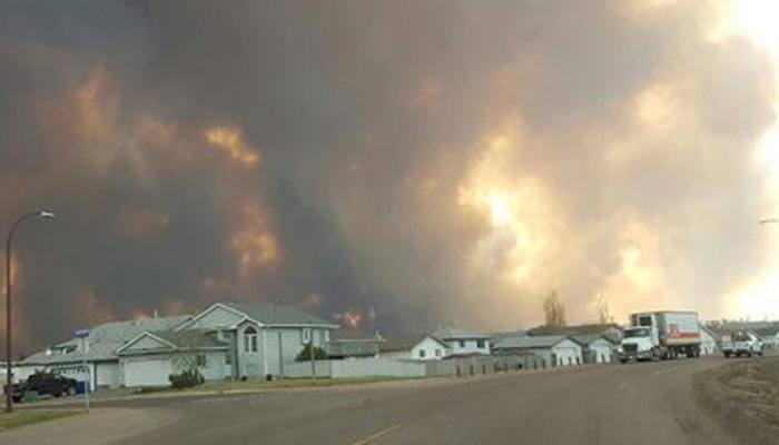 Canadian city evacuated as huge blaze engulfs homes