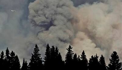 Airlift for thousands trapped by Canada wildfires