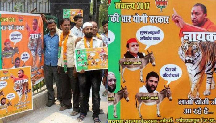 In new poster war, BJP&#039;s Yogi Adityanath rides a tiger, Rahul Gandhi shown sitting on a donkey