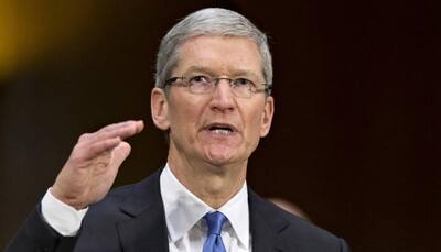 Apple's Tim Cook visits Beijing after China woes, Didi deal