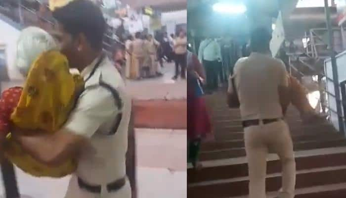 Act of humanity! Young cop lifts old woman in arms, helps her cross bridge during Simhasth Kumbh – Watch