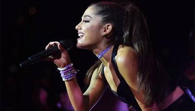 Ariana Grande trips at Billboard Music Awards red carpet