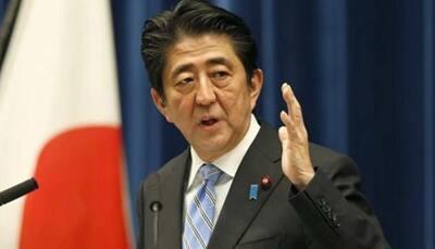 Japan PM Shinzo Abe delays tax hike in blow for Abenomics 
