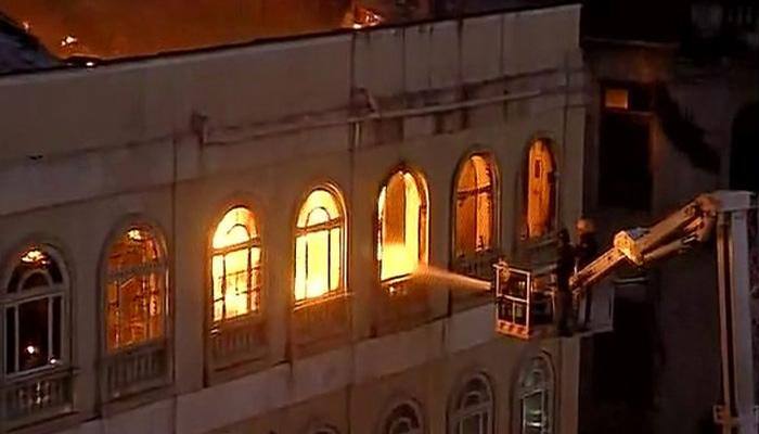 Fire-fighters battle to douse blaze at Metro House in Mumbai&#039;s Colaba