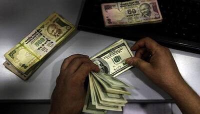 Rupee opens 3 paise higher against dollar at 66.74
