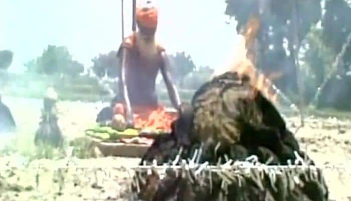 &#039;Lord of the Rings&#039; sadhu sits in the middle of 21 fire rings to appease rain gods