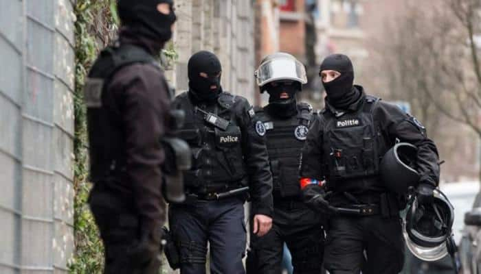 Belgian police arrest 12 suspected of planning new attacks