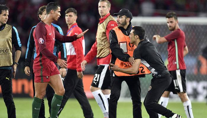 WATCH: RESPECT! Cristiano Ronaldo stops security, allows pitch invader to take selfie