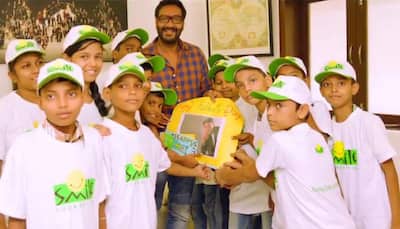 Father's Day special: Ajay Devgn spends candid time with underprivileged children