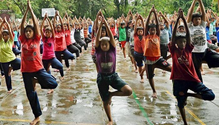 HRD Minister Smriti Irani asks parents, teachers to spend time with children practising yoga