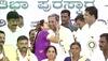 woman kisses Siddaramaiah