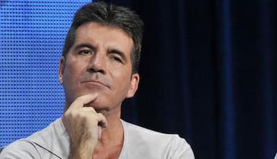 Simon Cowell donates 25K pounds for youth's cancer treatment