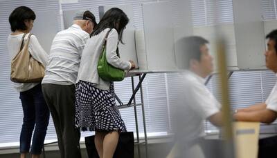 Japan's ruling bloc wins landslide in upper house election: Exit polls