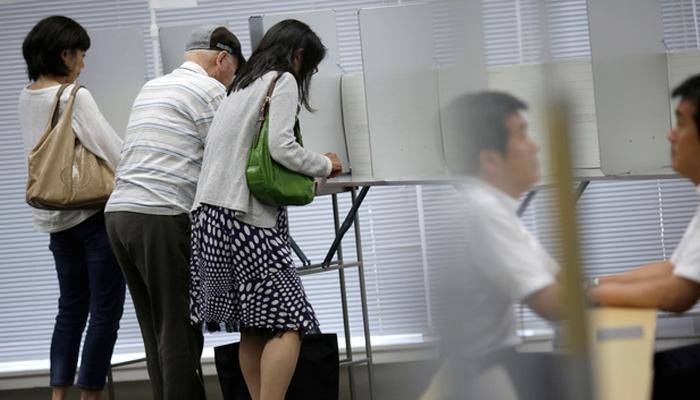Japan's ruling bloc wins landslide in upper house election: Exit polls