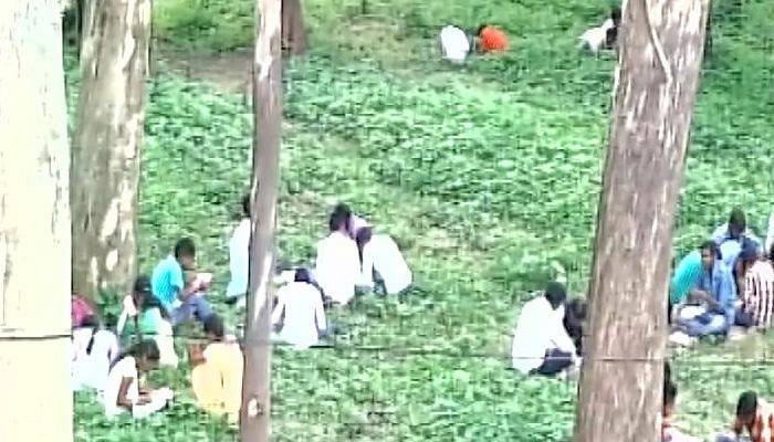 Dhanbad 'betters' Bihar: Students sit under trees, write exams from books; father answers for his son
