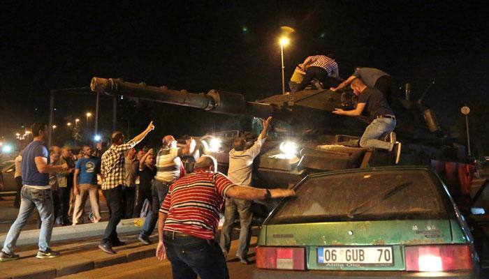 Turkey army says it seizes power; Erdogan vows a "very heavy price"