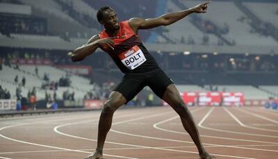Usain Bolt eases to victory, Kendra Harrison hurdles to glory
