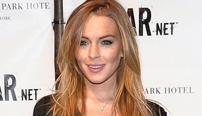 Lindsay Lohan's dad confirms it's 'baby on board' for her