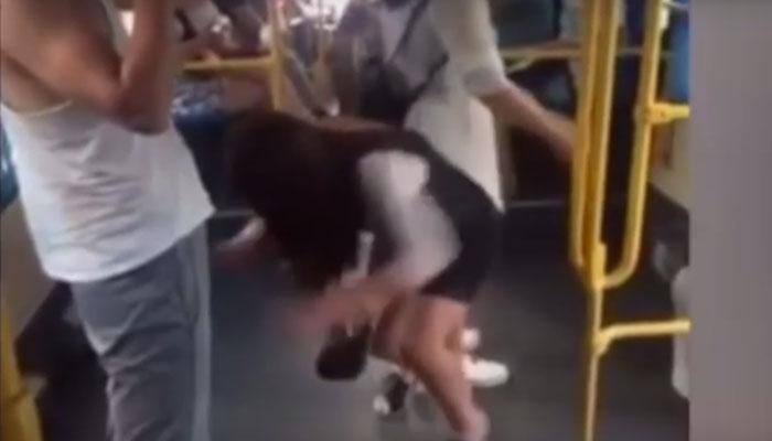 Hilarious: Chinese girl slips and pulls down man&#039;s shorts in bus, this video will leave you in splits