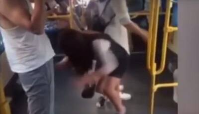 Hilarious: Chinese girl slips and pulls down man's shorts in bus, this video will leave you in splits